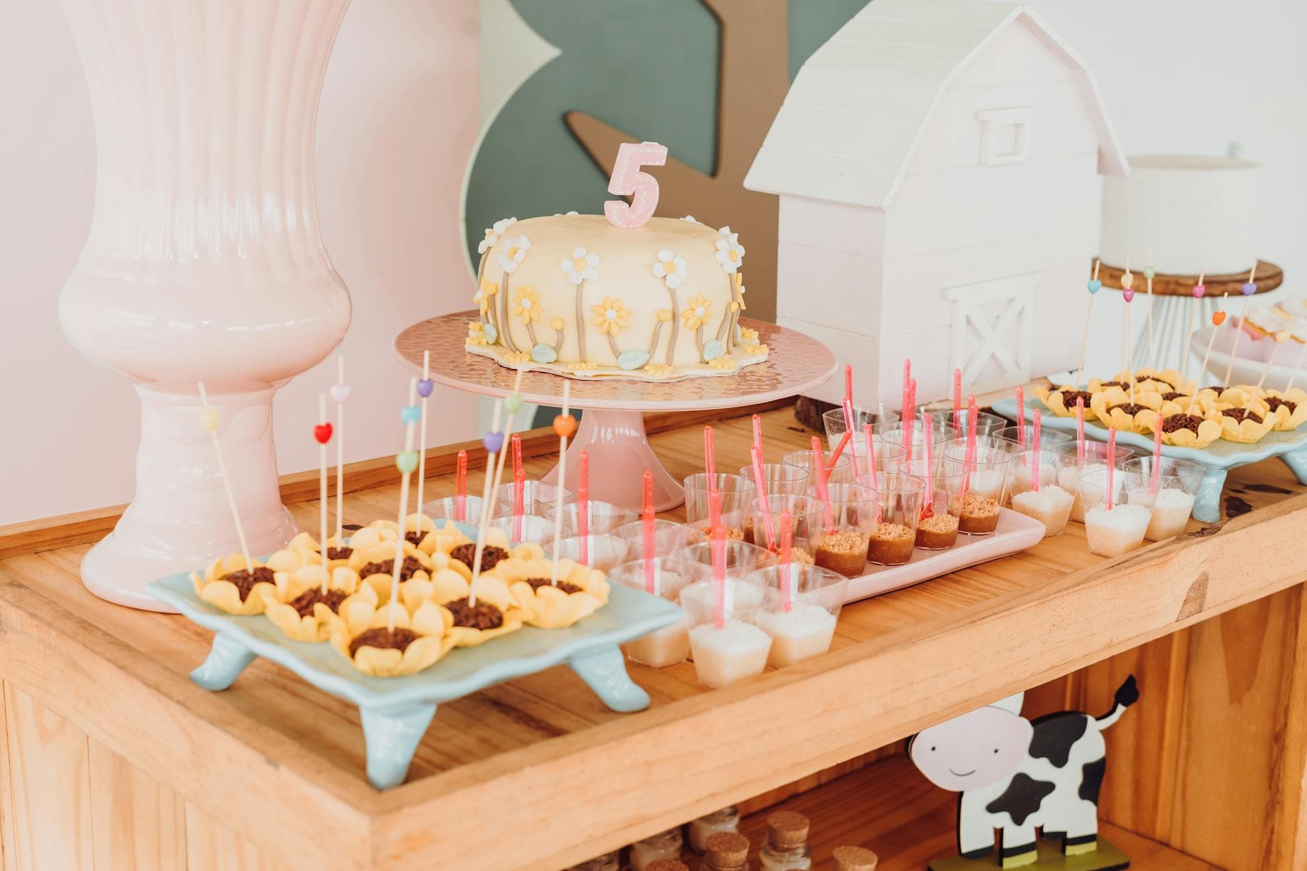 Kids party dessert table with cake and treats